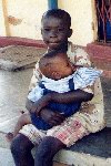 (Photograph of a young boy and a baby in Soroti)